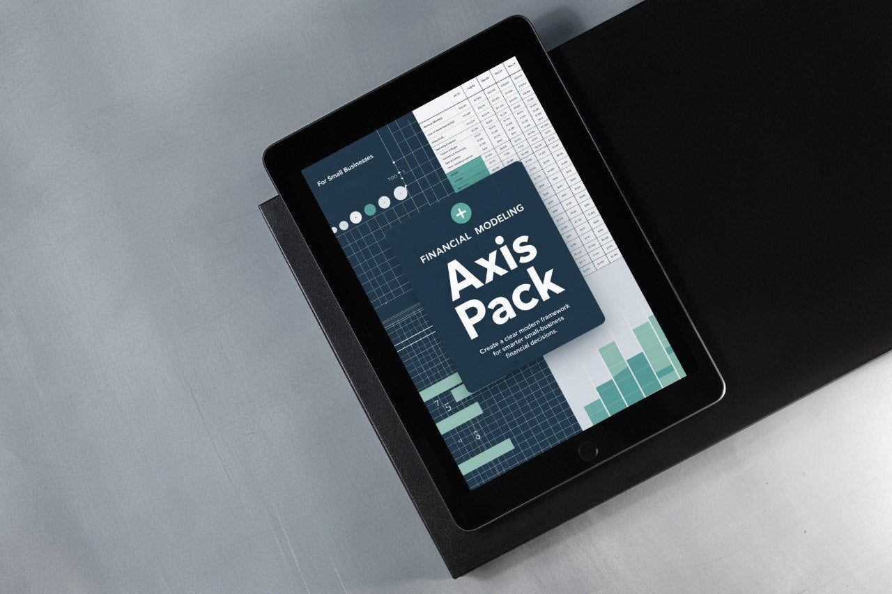Tablet displaying a financial modeling software package on a gray surface