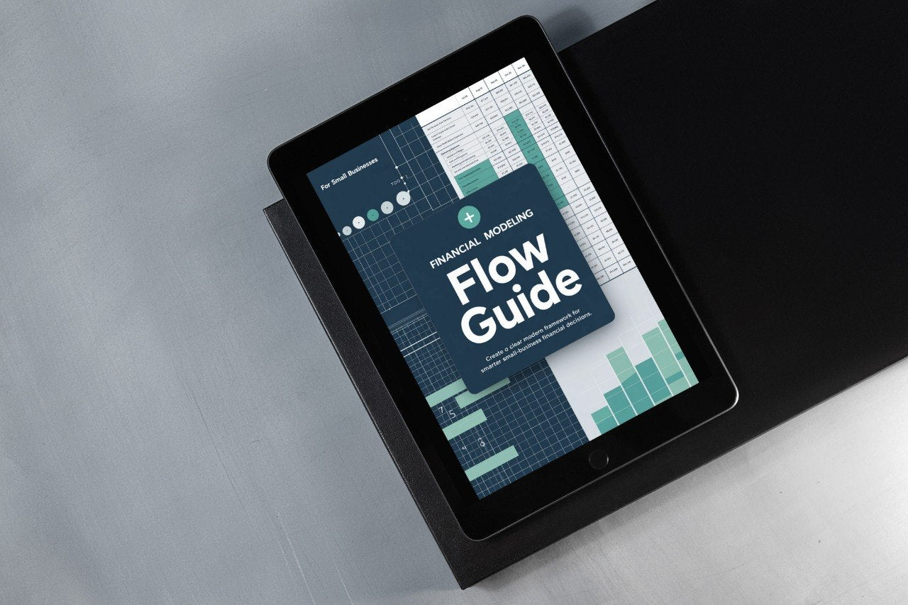 Digital tablet displaying a 'Financial Modeling Flow Guide' on a gray surface