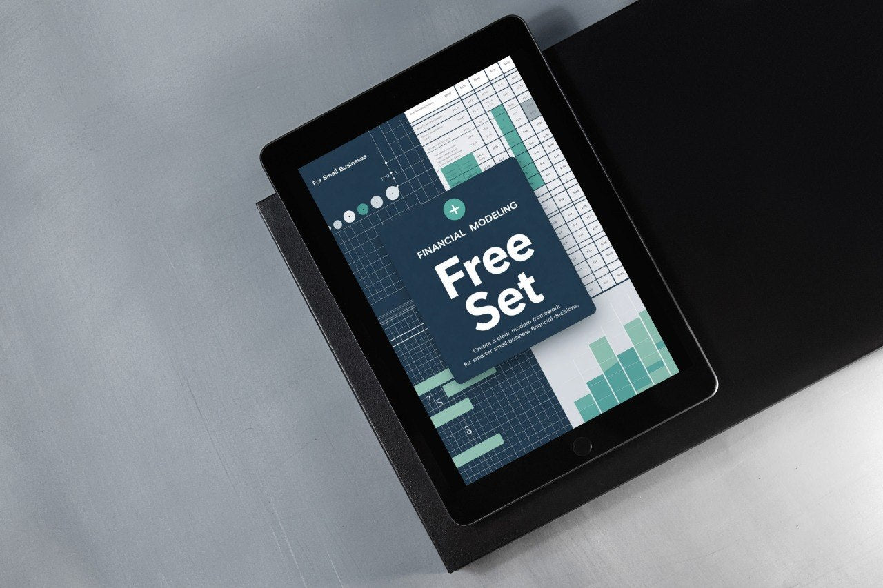Tablet displaying a financial modeling template with 'Free Set' text on a gray surface