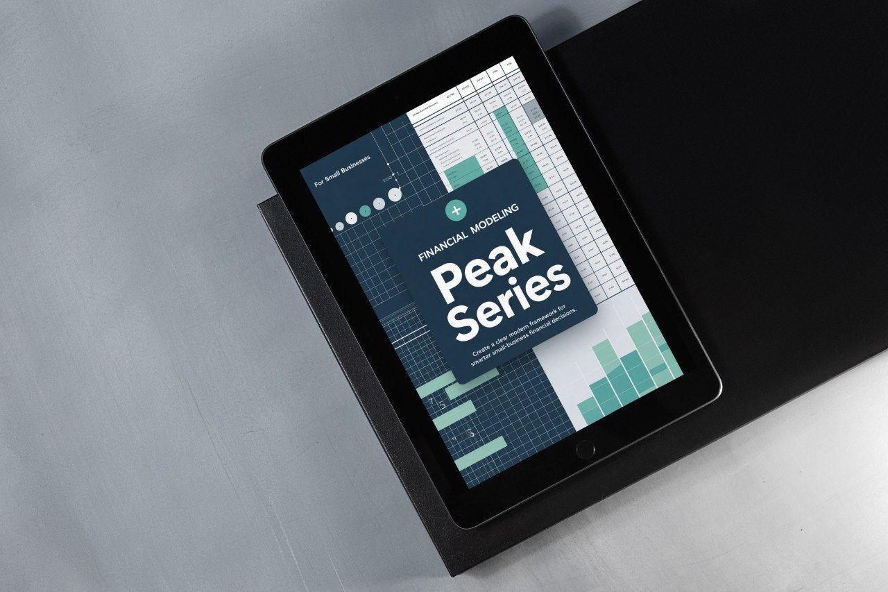 Tablet displaying 'Peak Series' financial modeling app on a gray surface